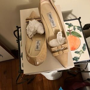Jimmy Choo nude pump. Bow design, in good shape.